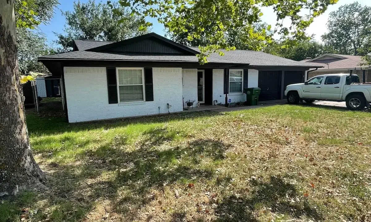 Professional roofing crew working on a residential roof in Cocoa
